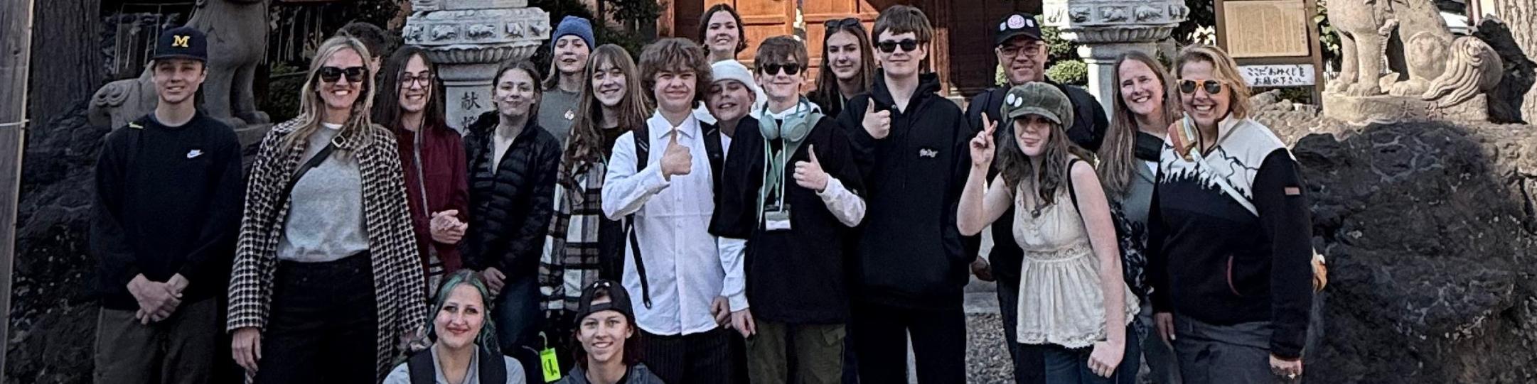 A group students, parents and teachers pose for a picture during a trip to Japan