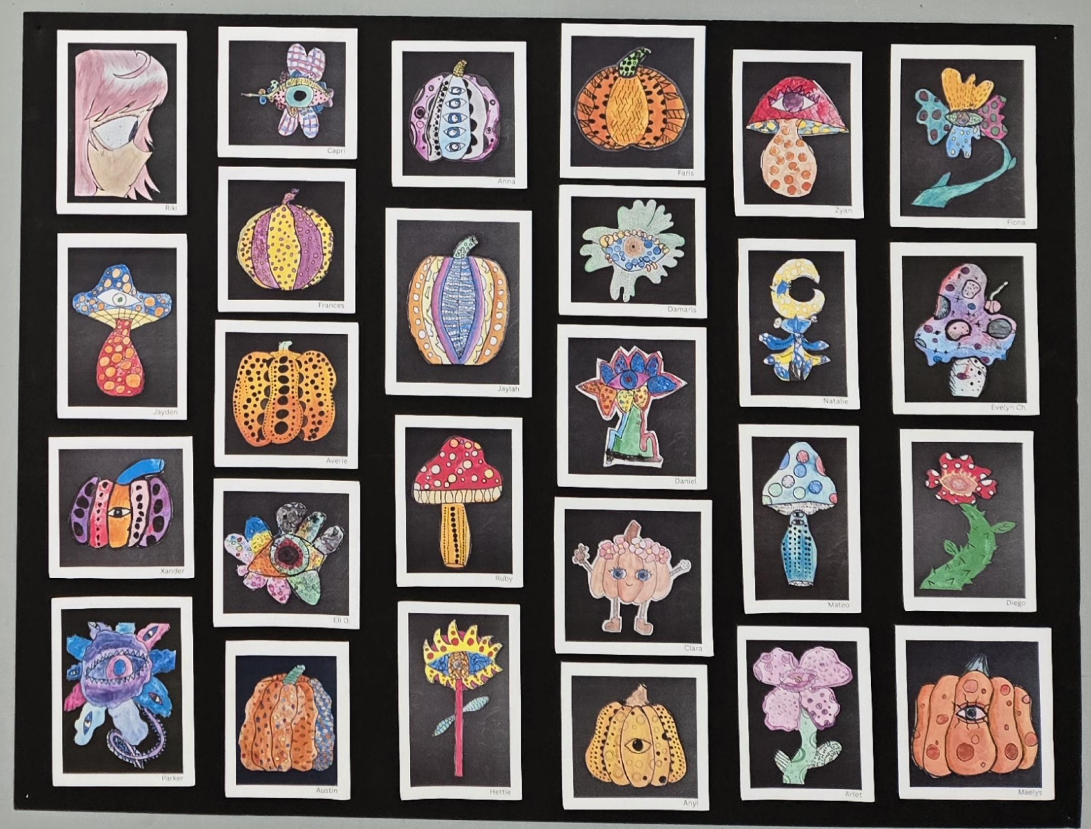 Art work from students is shown on a display board. Students drew pictures of nature with a twist. Most of the work contain mushroom or flower with a human eye incorporated into the image. 